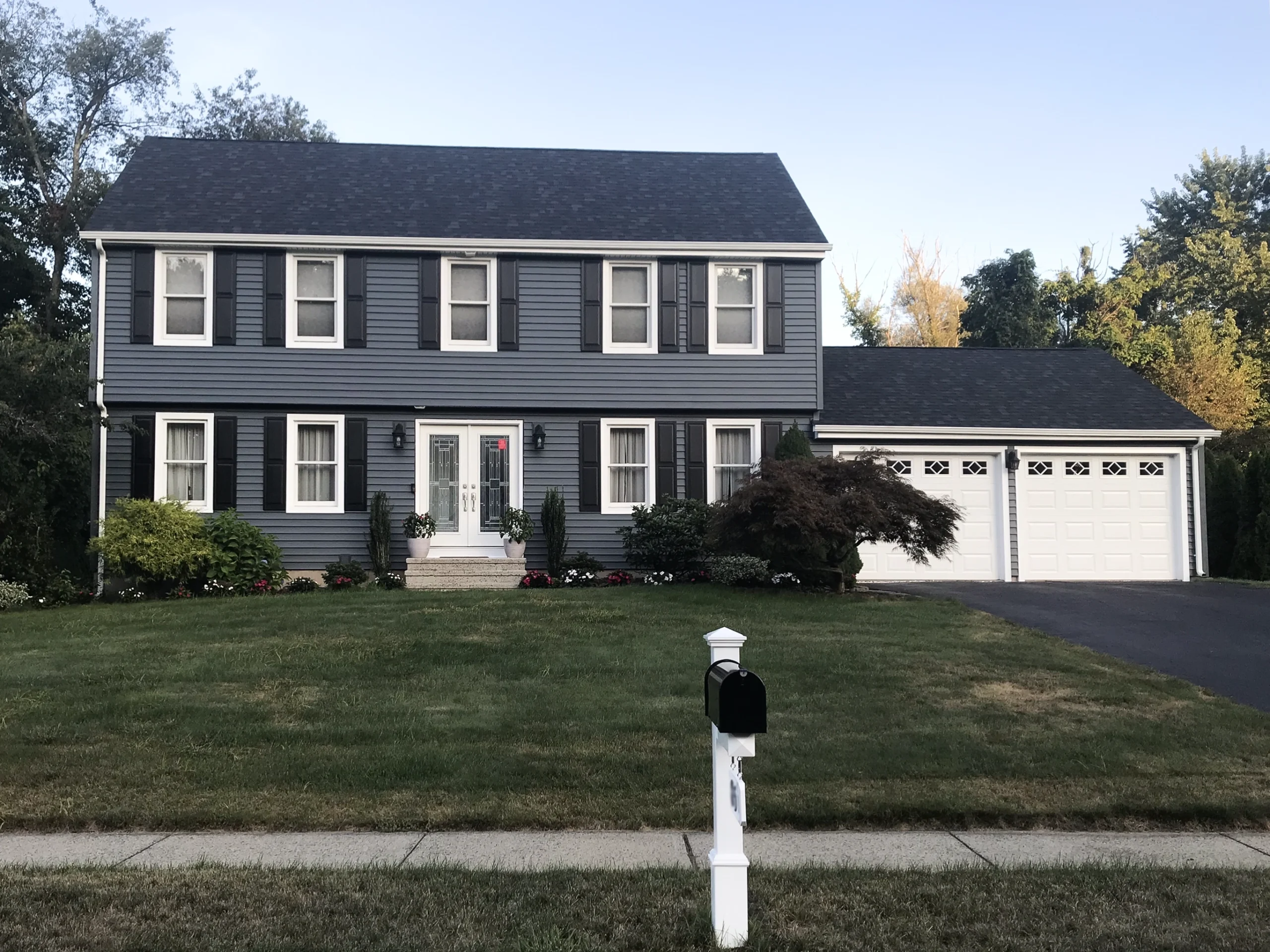 Modern house with upgraded blue vinyl siding